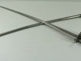two swords on a white table with a black background