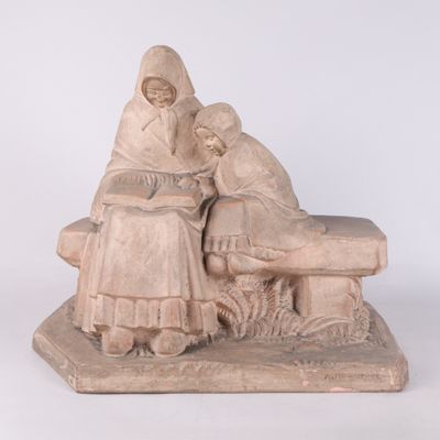 une statue représentant une femme et un homme assis sur un banc