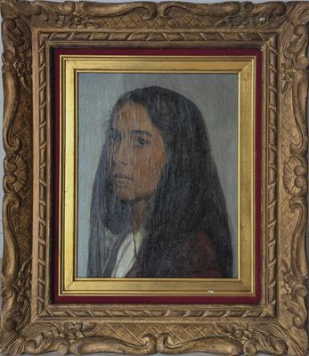 un tableau représentant une femme voilée, dans un cadre doré