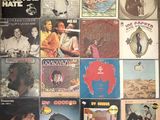 a picture of a collage of records on the wall