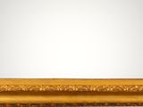 a gold framed mirror with a decorative pattern on the edge