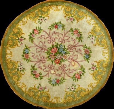 a close up of a plate with flowers on it on a black background