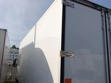 a white truck that is parked next to a white truck