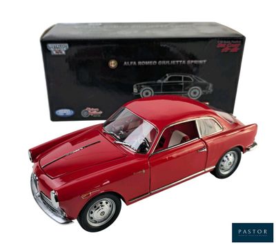 red model car in front of a black box on a white background
