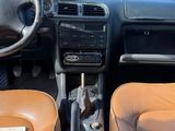 dashboard of a car with brown leather seats and dashboard controls