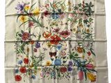an image of a white handkerchief with colorful flowers on it