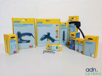 a lot of different types of staplers in the box