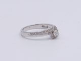 an image of a diamond ring on a white surface