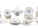 a lot of white and blue plates and bowls