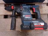 a cordless drill that is sitting on a pallet