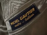 the label on the back of a jacket that says michel gautir