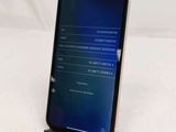 a phone that is sitting on a stand on a table