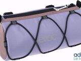 purple and black travel bag with zippers on top of it