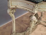 a marble topped table with a mirror on top of it
