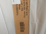 a cardboard box with a label on it sitting on a bed