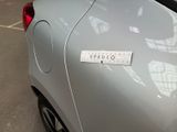 a car with a sticker on the side of it ' s door