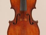 an old violin with a bow hanging from it ' s back