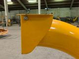 a close up of a yellow pipe in a warehouse
