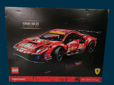 a box with a toy car in it on a blue surface