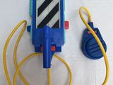 a blue and yellow toy phone with a yellow cord attached to it