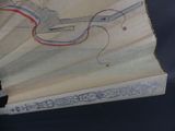 a drawing of a gun on a book on a table