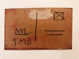 a piece of cardboard with writing on it on a table