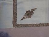 a picture of a piece of cloth with a picture of a bird on it