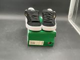 a pair of shoes that are on top of a box