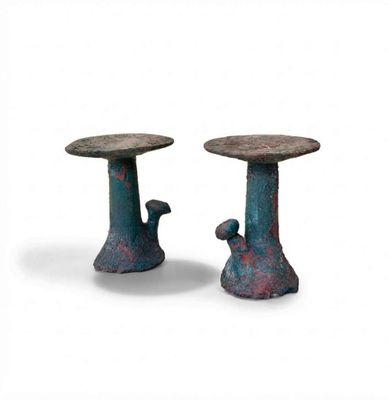 two small tables that are sitting next to each other