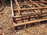 a wooden structure in the middle of the woods