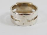 an image of a silver ring on a white surface
