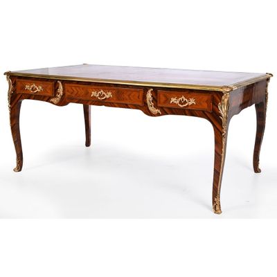an antique writing table with two drawers and a marble top