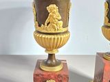 two vases sitting on top of each other on a table