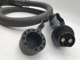 two black wires connected to each other on a white surface