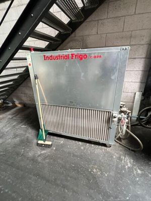 an industrial fridge sitting in the middle of a room
