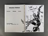 someone is drawing a spider - man on a notebook with a pen