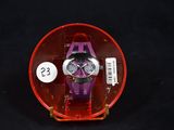 a purple watch in a red case on a black background