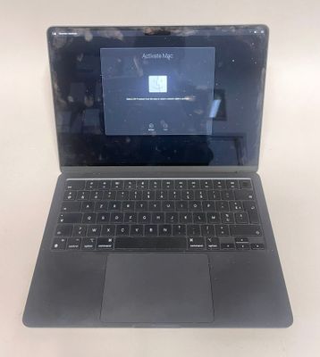 an open laptop computer sitting on top of a white table