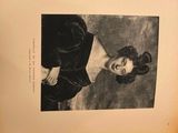 an old black and white photo of a woman in a black dress