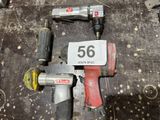 two air tools that are sitting on the floor