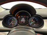 a close up of a car dashboard with various gauges