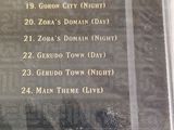 the back of a cd case with a picture of a concert program on it