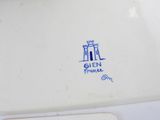 a close up of a plate with a blue and white design on it