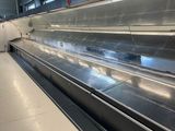 an empty conveyor belt in the middle of an airport