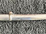 an image of a sword that is laying on the ground
