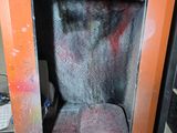 a small oven that is sitting in the corner of a room