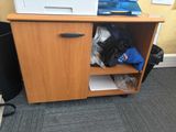 a wooden cabinet with a printer on top of it