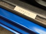 a sticker that says vaalfo on the side of a blue car