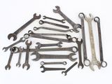 a lot of wrenches that are sitting on a table
