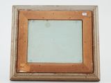 an old picture frame with a picture of a dog in it